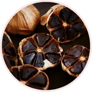 Black Garlic in halves inside a bowl