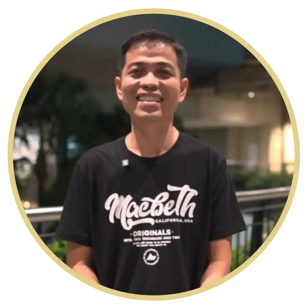 Arnel - Holy herbs advocate smiling at the camera showing the holy herbs bottle