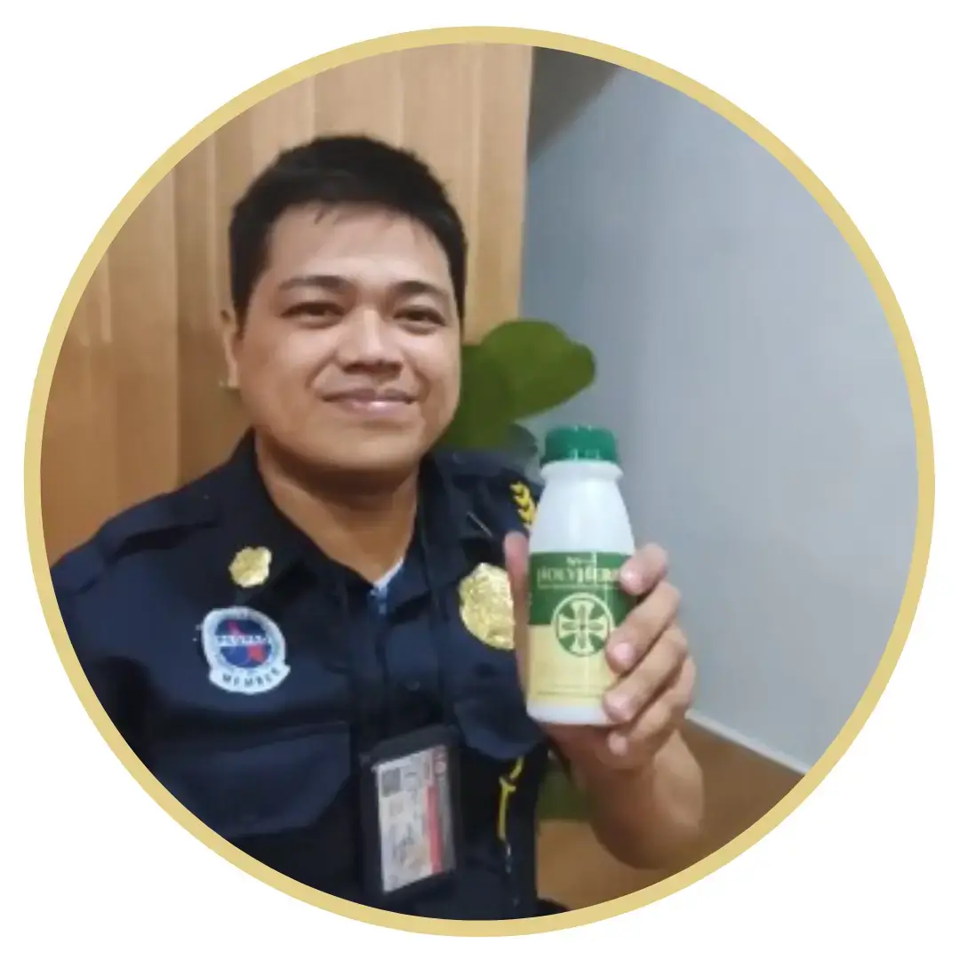 Ren - Holy herbs advocate smiling at the camera showing the holy herbs bottle